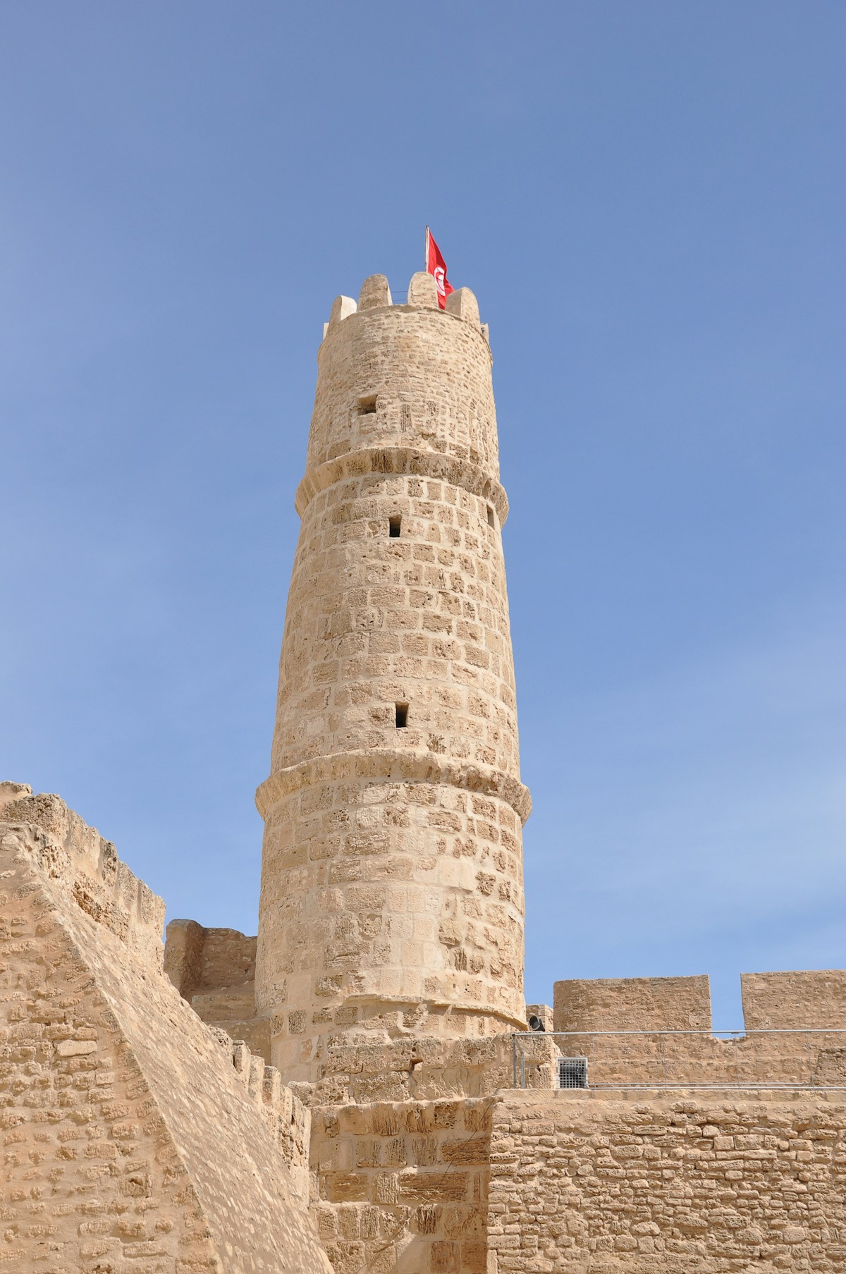 The Ribat fortress tower of Monastir with the Tunisian flag, Tunisia