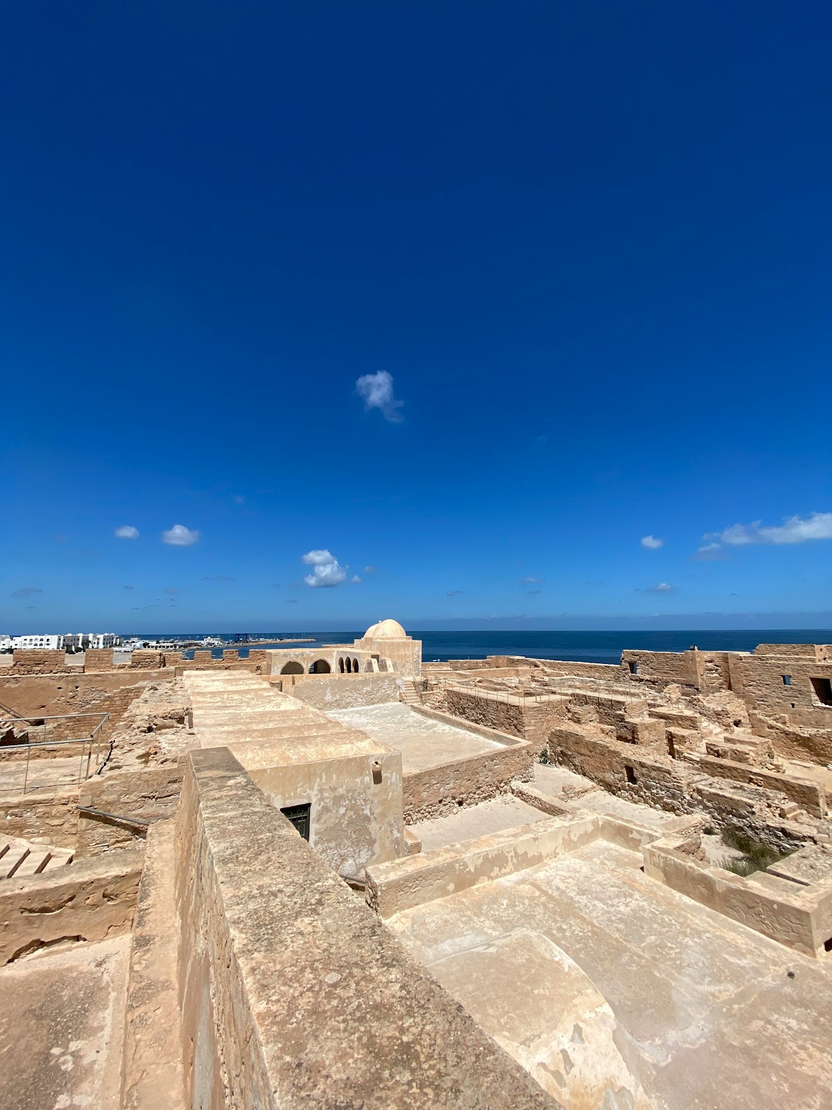 Ancient stone fort with domed chamber and clear blue sky on Djerba island, Tunisia
